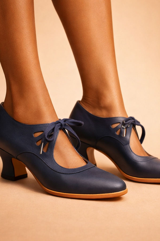 Close-up of the delicate lace-up detailing on the front of the Talia leather lace heels.