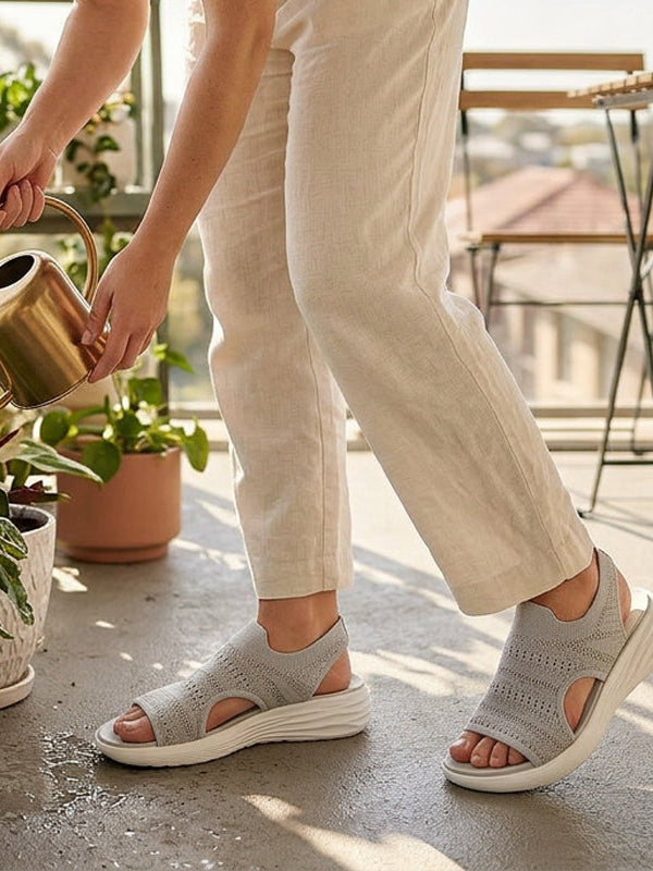 Black platform sandals placed on a clean surface, emphasizing their versatile design for various outfits.