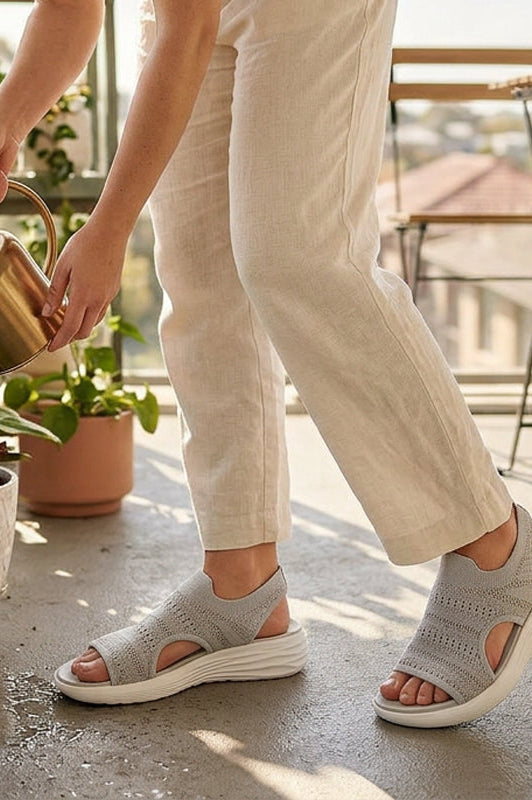 Black platform sandals placed on a clean surface, emphasizing their versatile design for various outfits.