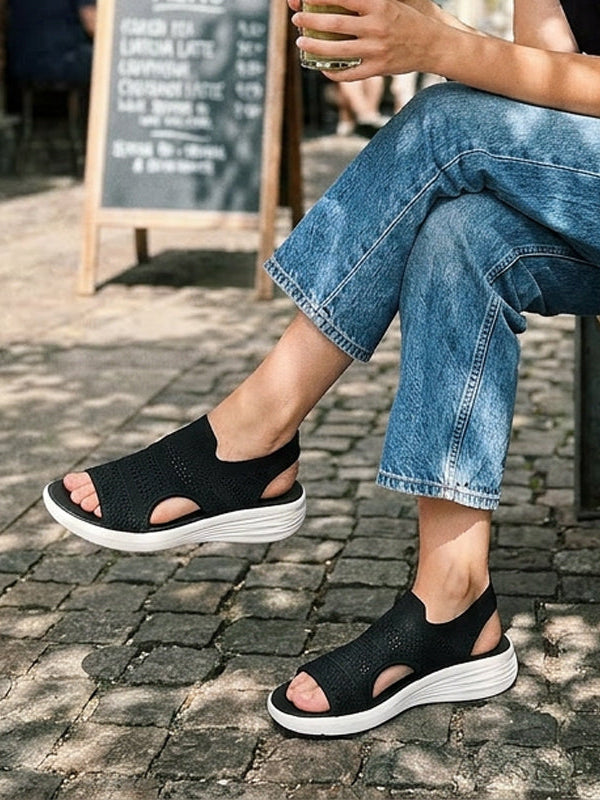 Pink knit platform sandals styled with a summer dress, perfect for a relaxed yet elevated look.