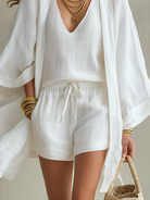 Stack of white casual shorts in different sizes, ready for easy selection and comfortable wear.