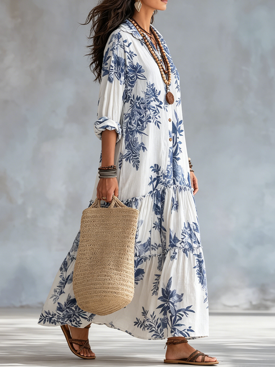 Lifestyle shot of a woman enjoying a warm day in her comfortable blue floral short sleeve maxi dress.