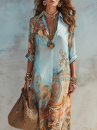 Stylized shot of the blue short sleeve maxi dress on a hanger, showcasing its vibrant pattern and material.