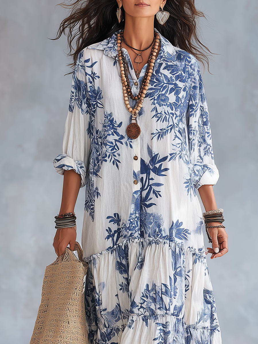 Textile detail of the soft, lightweight woven fabric and intricate blue floral pattern on the short sleeve maxi dress.