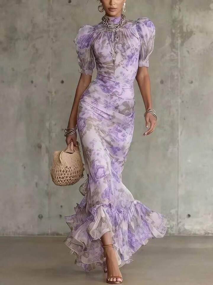 Back view of the romantic pink floral maxi dress, emphasizing its elegant drape and overall design.