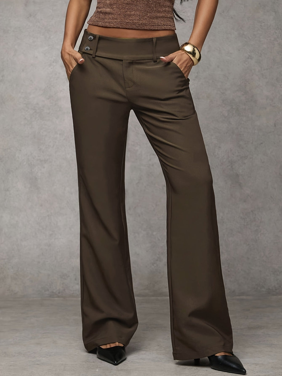 Pair of wine red loose trousers folded neatly, emphasizing their soft, airy feel and versatile style.