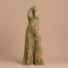Close-up detail of the pleated design and V-neckline on the elegant green women's jumpsuit.