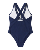 Model posing elegantly in the black one-piece swimsuit, suitable for various body types.