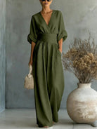 Detailed shot illustrating the subtly integrated pockets on the olive green fashionable jumpsuit.