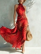 Model walking in the Elysia glamorous animal print maxi dress, illustrating the airy movement and graceful drape.
