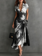 Blue artistic print maxi dress in a cafe setting, ideal for smart-casual engagements and afternoon tea.