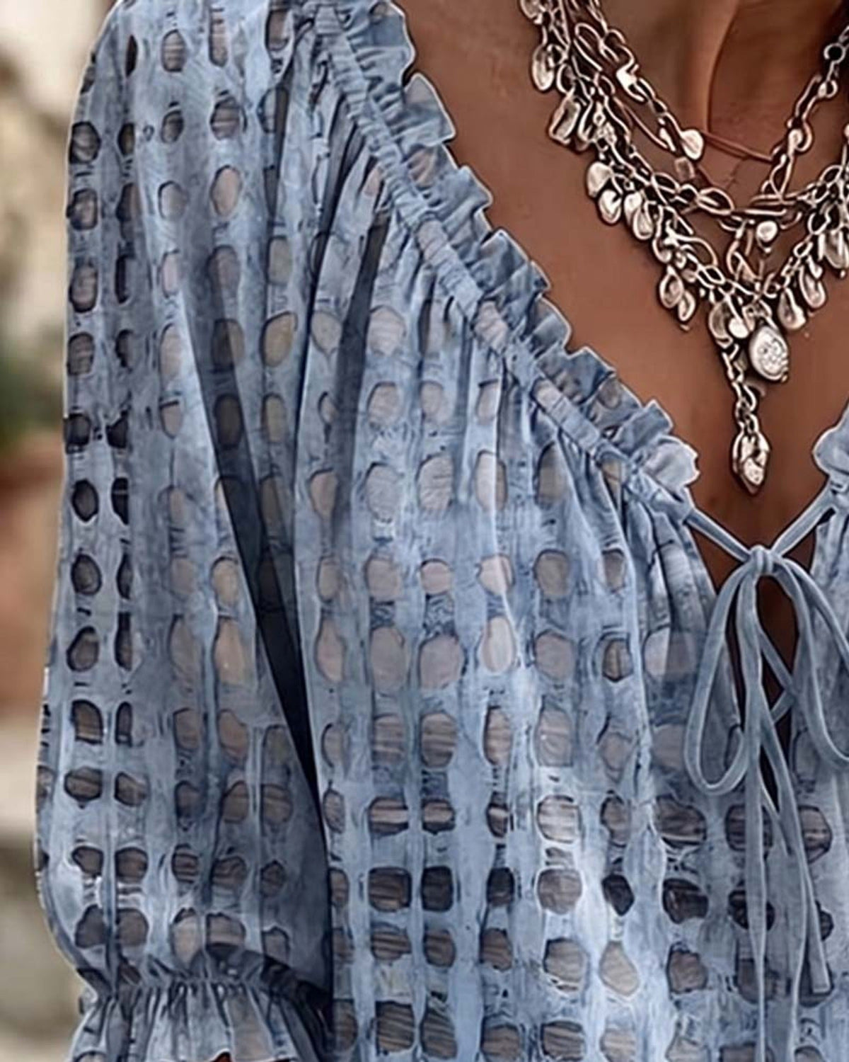 Brown Xylia blouse shown from an elevated angle, highlighting the overall relaxed shape.