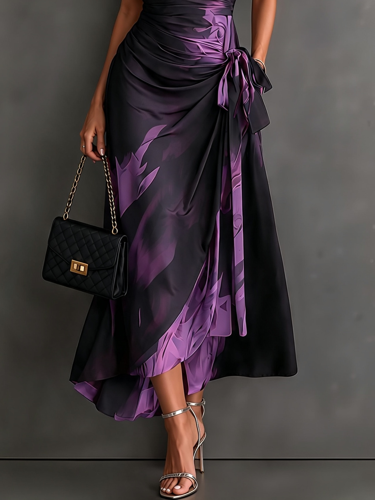Grey abstract pattern maxi dress with a close-up on the tie-waist detail, enhancing the fit.