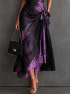 Grey abstract pattern maxi dress with a close-up on the tie-waist detail, enhancing the fit.