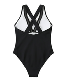 Woman relaxing poolside in the navy one-piece swimsuit, exuding confidence and comfort.