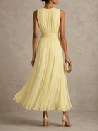 Back view of the pink maxi dress, emphasizing the graceful drape of the breathable chiffon fabric.