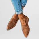 Close-up side profile of a brown suede loafer, highlighting the soft texture of the upper and the subtle heel design.