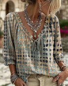 Detailed view of the three-quarter sleeves on the pink Xylia blouse with a subtle cuff.
