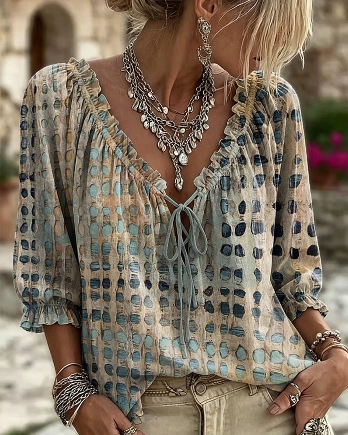 Detailed view of the three-quarter sleeves on the pink Xylia blouse with a subtle cuff.