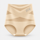 Hand holding the soft, stretchable fabric of the shaping underwear to show its texture.