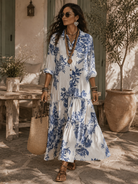 Close-up detail of the delicate collar and button-down front on the elegant blue floral short sleeve maxi dress.