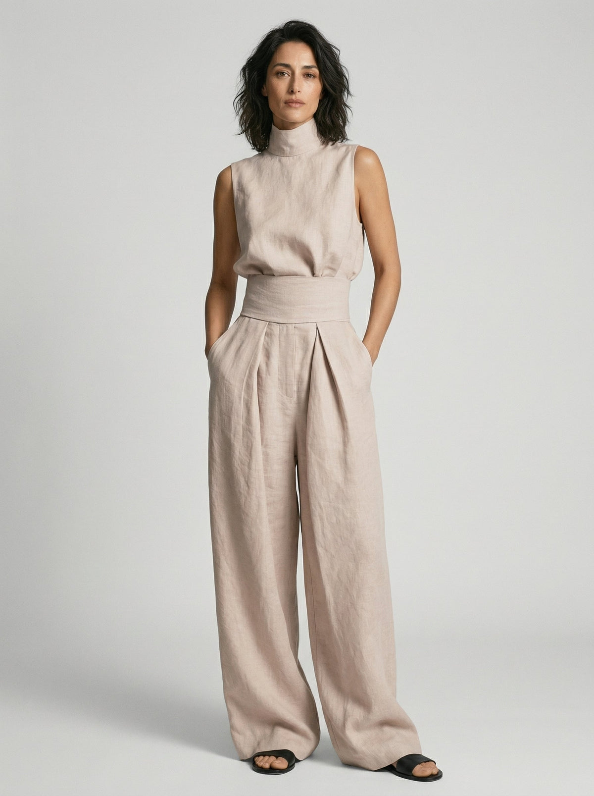 Close-up of the natural cotton fabric on the wide-leg trousers, showing its soft, breathable weave.