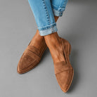 Front view of Camille women's grey suede loafers on a light background, showcasing the pointed toe and low wedge heel.