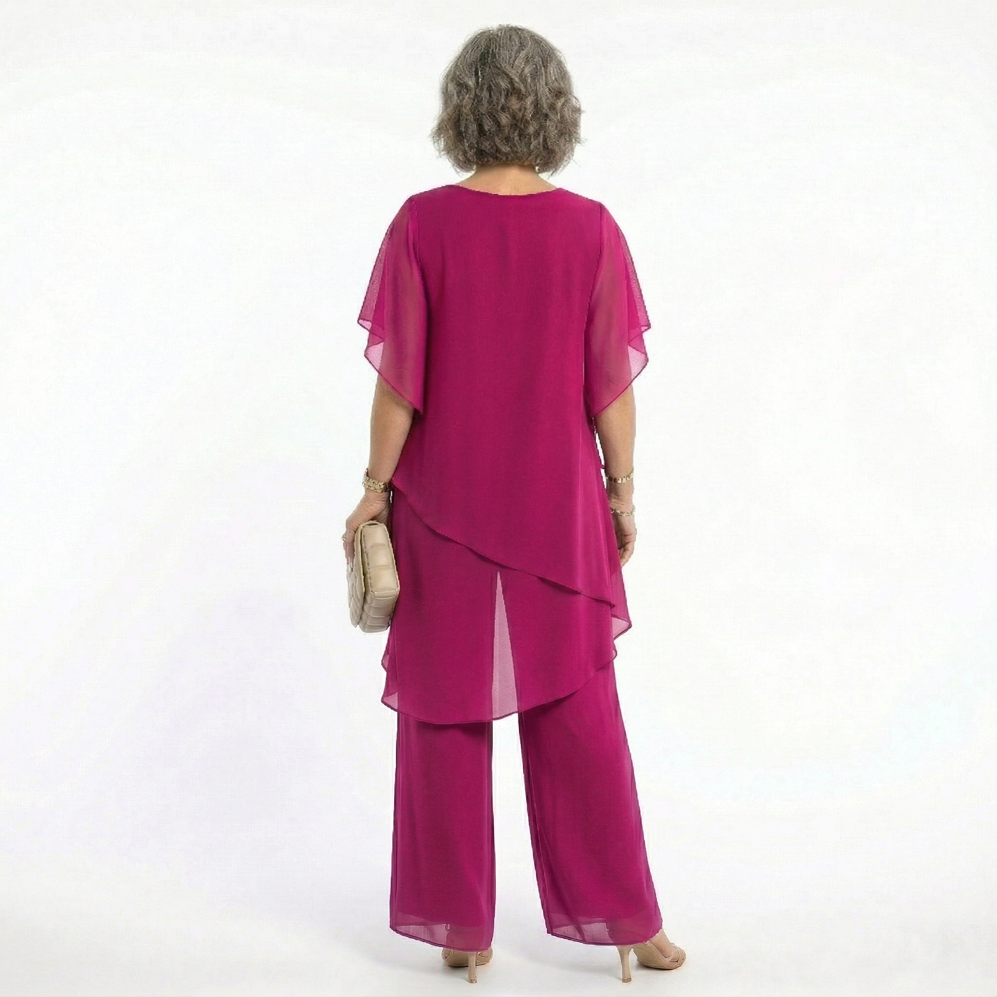 A stack of folded Tamsin blouses in various available colors, highlighting the range of choices.