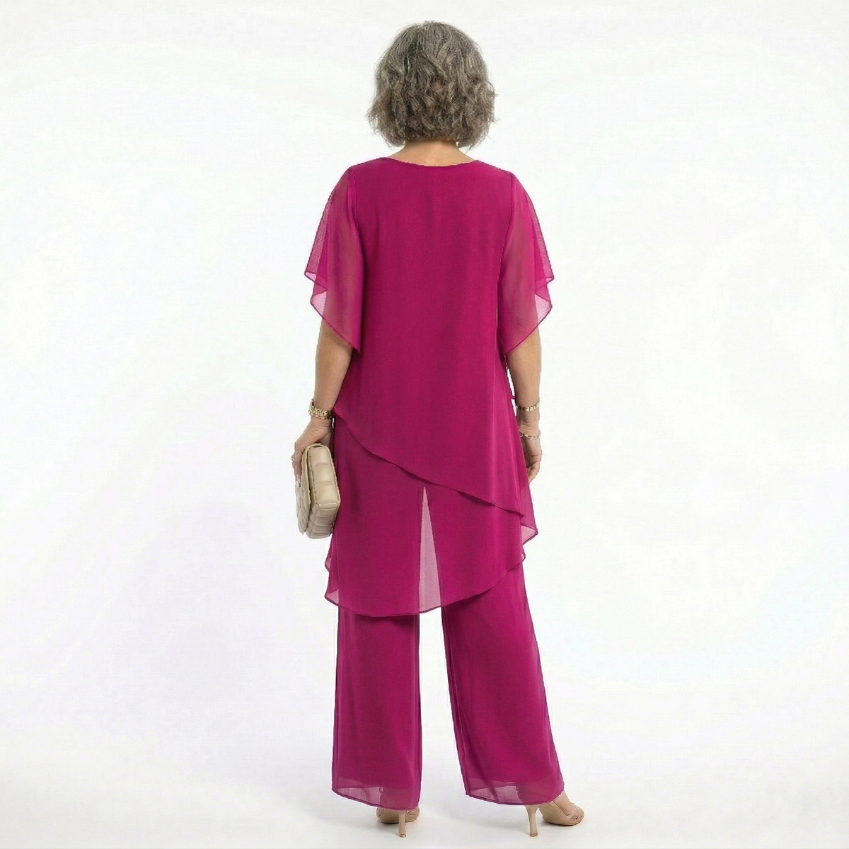 A stack of folded Tamsin blouses in various available colors, highlighting the range of choices.