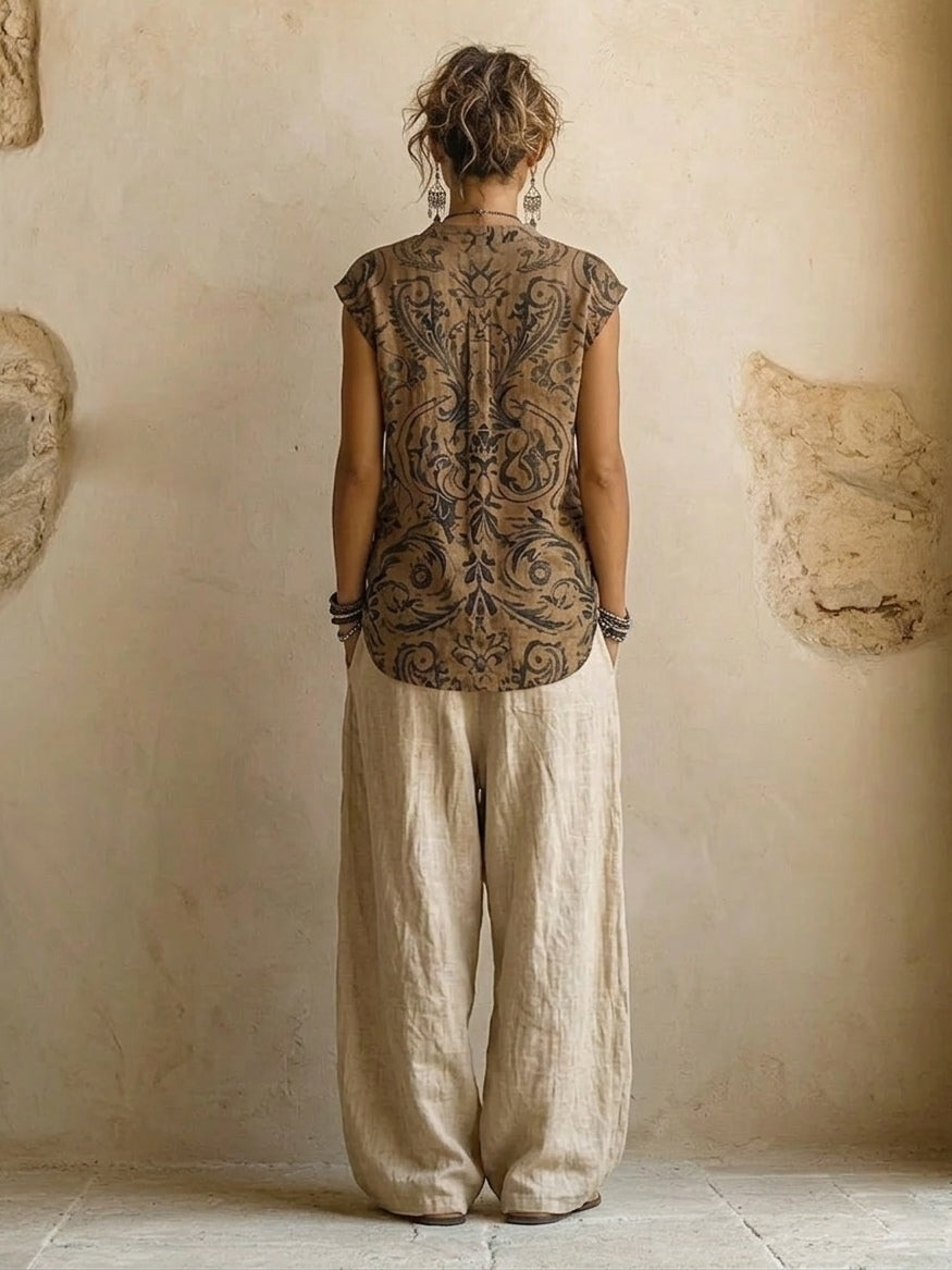 Side profile of a woman posing in versatile brown wide-leg trousers, highlighting their elegant drape.