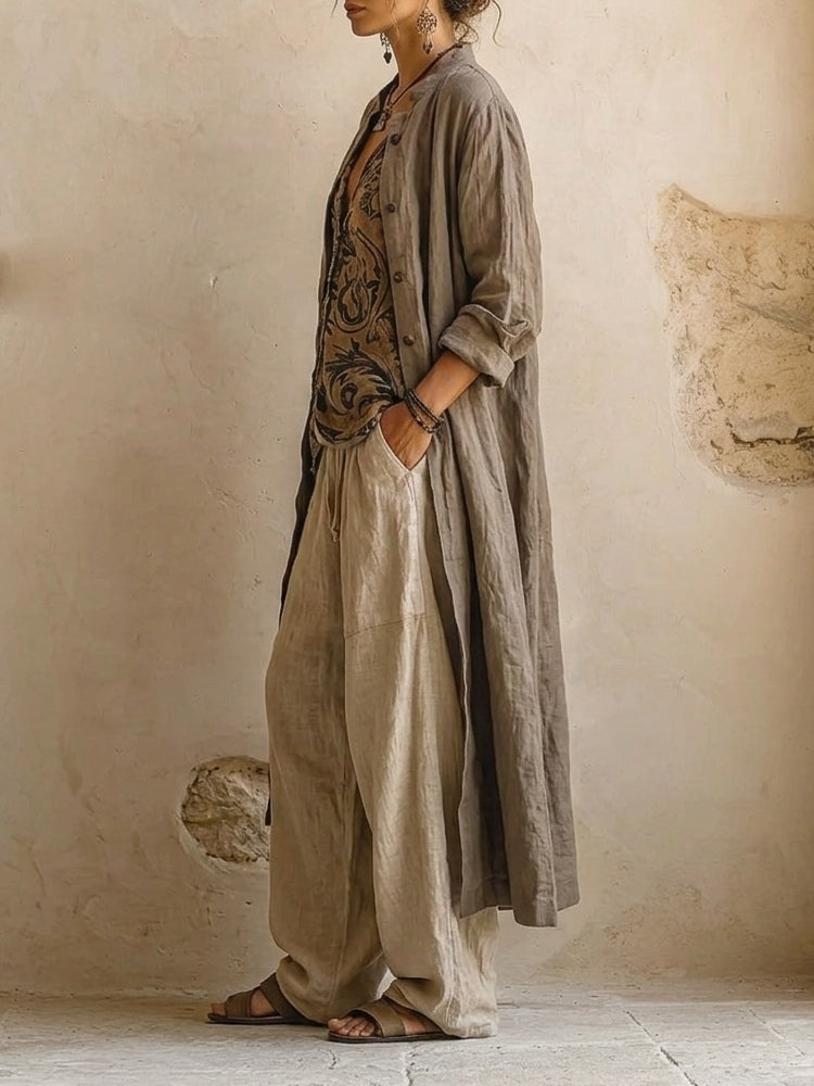 A pair of brown wide-leg trousers laid flat, displaying the texture and relaxed cut of the breathable fabric.