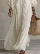 Rear view of the versatile bohemian lace maxi dress, demonstrating its elegant drape and full coverage.