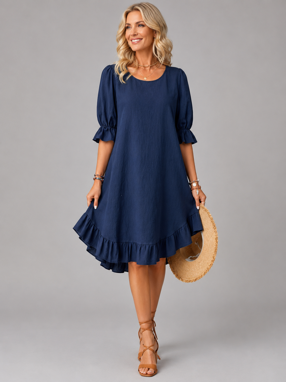 Woman wearing a brown Zenia dress, front view, showcasing the relaxed flowing silhouette.