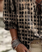 Lifestyle image of the lilac Xylia blouse, worn casually for a comfortable day out with friends.
