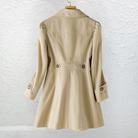 Detailed shot of the adjustable cuff and sleeve design on the Adeline elegant summer trench coat.
