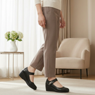 Side profile of the black Alana mid-heel comfort shoes, highlighting the ergonomic 1.5-inch heel and adjustable strap.