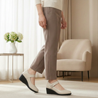 Close-up of the beige Alana mid-heel comfort shoes, focusing on the decorative detail on the strap and the refined leather texture.