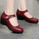 An angled view of the red Alana mid-heel comfort shoes, emphasizing the gentle curve and supportive design.
