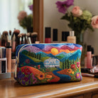 Front view of the Anouk vintage quilted cosmetic bag in a fantasia viaggio retrò print, showcasing its elegant design and texture.