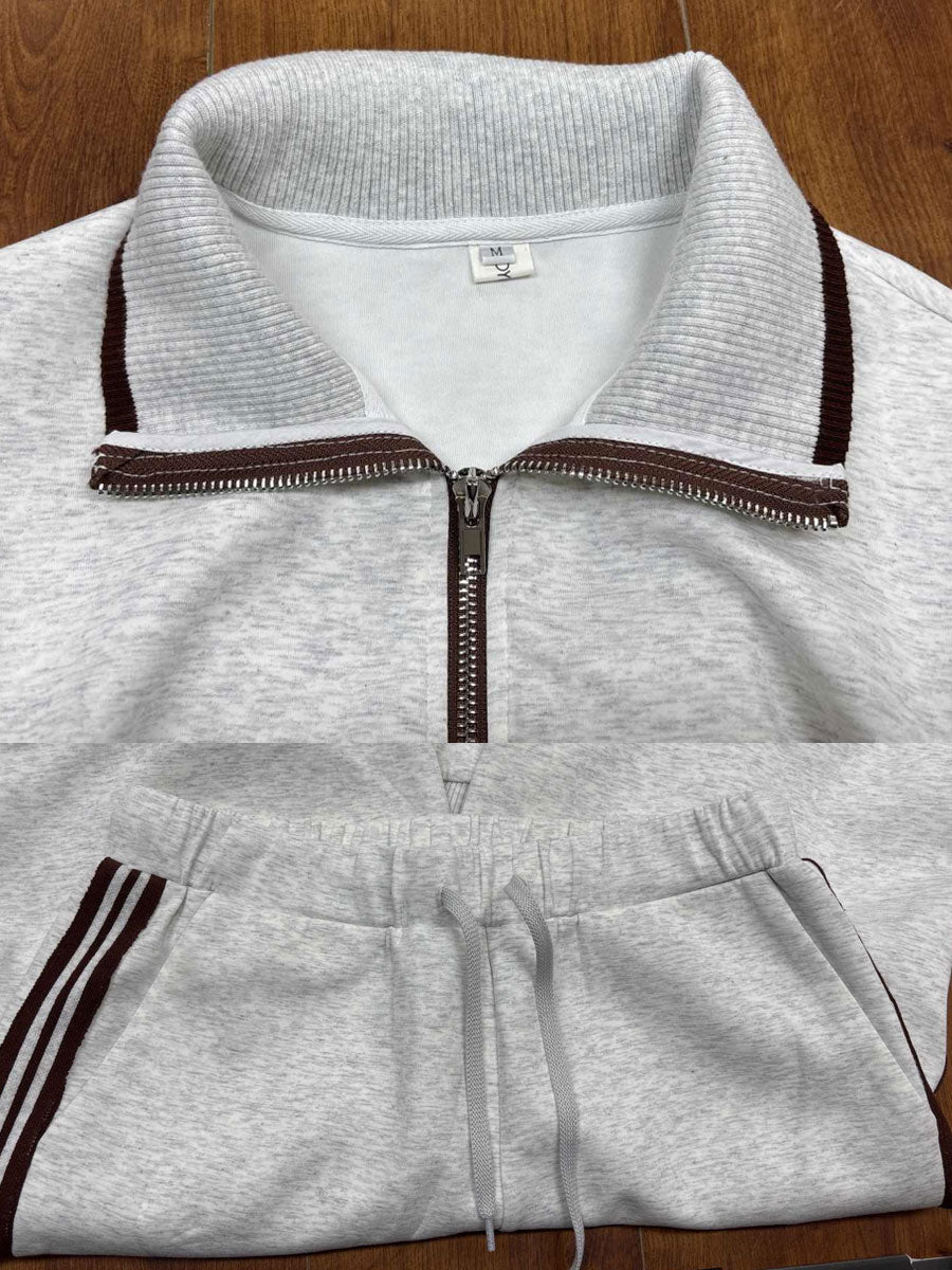 Woman in Anouk relaxed fit pants interacting in a casual environment, emphasizing practical elegance.