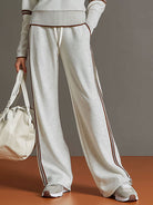 Anouk relaxed fit pants paired with casual footwear, demonstrating versatile styling options.