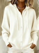 Side profile of a woman wearing a white Anouk T-shirt, highlighting the drape and casual style.