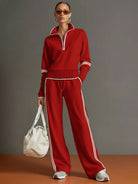 Woman casually posing in Anouk relaxed fit pants, demonstrating ease of movement and relaxed style.