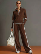 Woman walking outdoors in Anouk relaxed fit pants, illustrating the versatility for active yet comfortable wear.