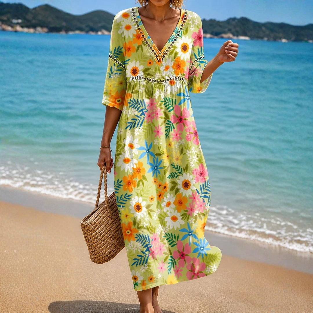 Front view of a woman wearing a Bianca Beautiful Floral Midi Dress, showcasing its vibrant pattern and flowing silhouette.