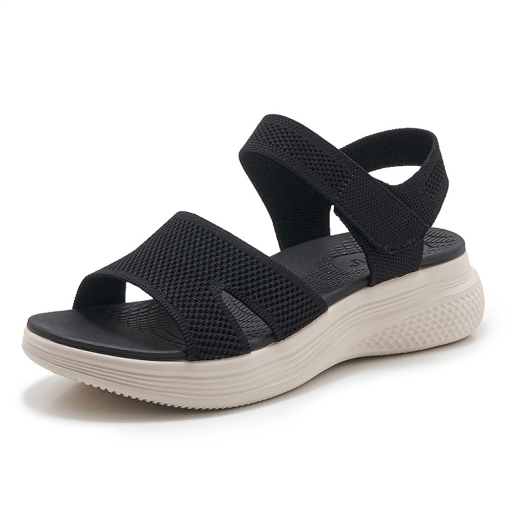 Close-up detail of the green arch support walking sandals, focusing on the texture of the straps and stitching.