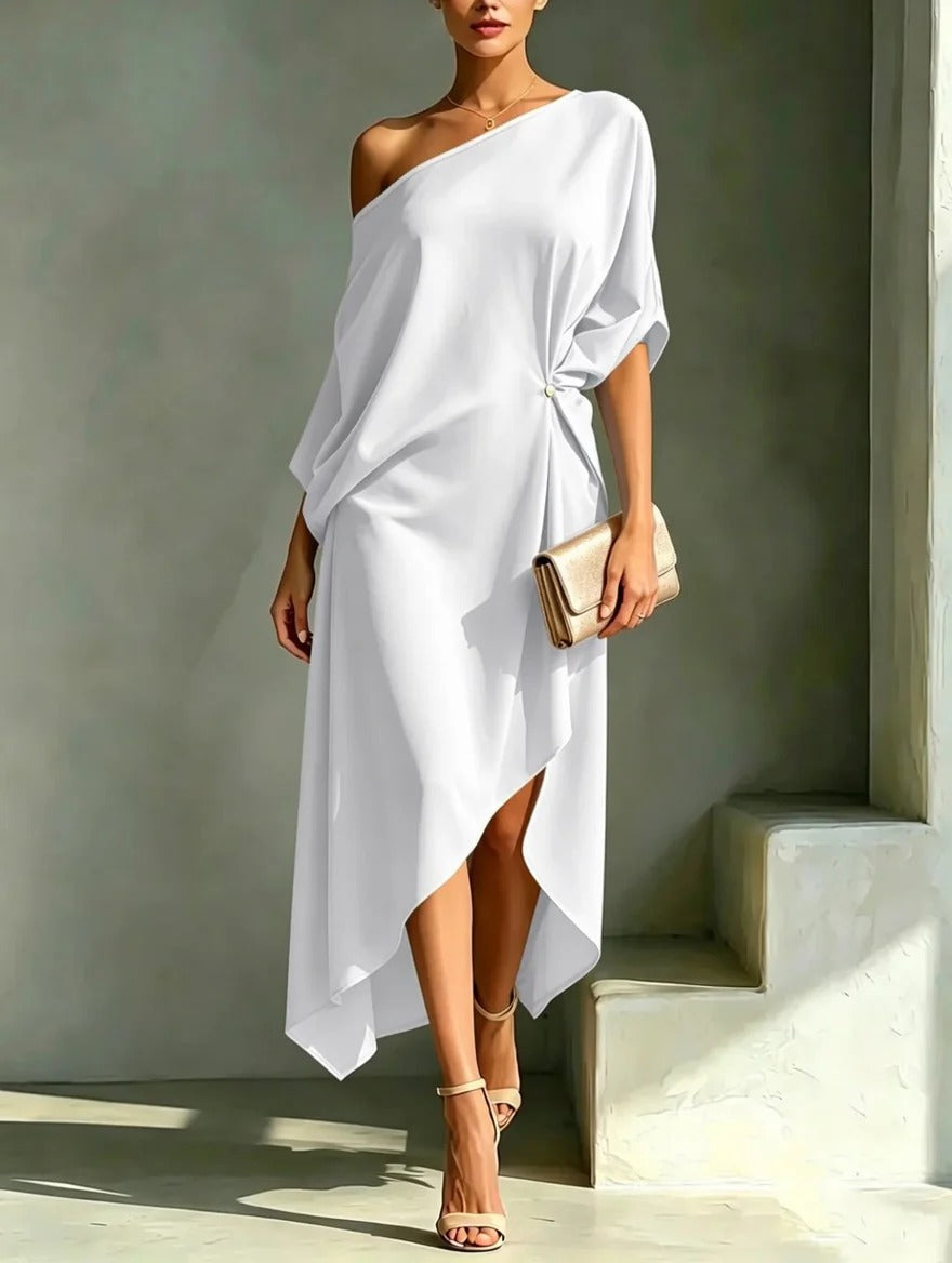 A model gracefully walking in a yellow Lana elegant asymmetrical midi dress, demonstrating its airy movement and dipped hem.
