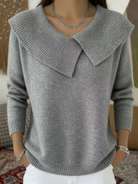 Woman wearing deep blue classic comfort pants, styled with a casual top in an outdoor setting.