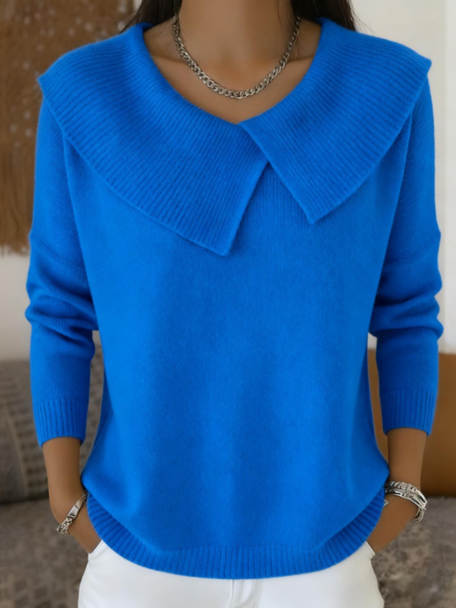 Rear view of the deep blue wool blend pants, showing the flattering fit and fabric flow.