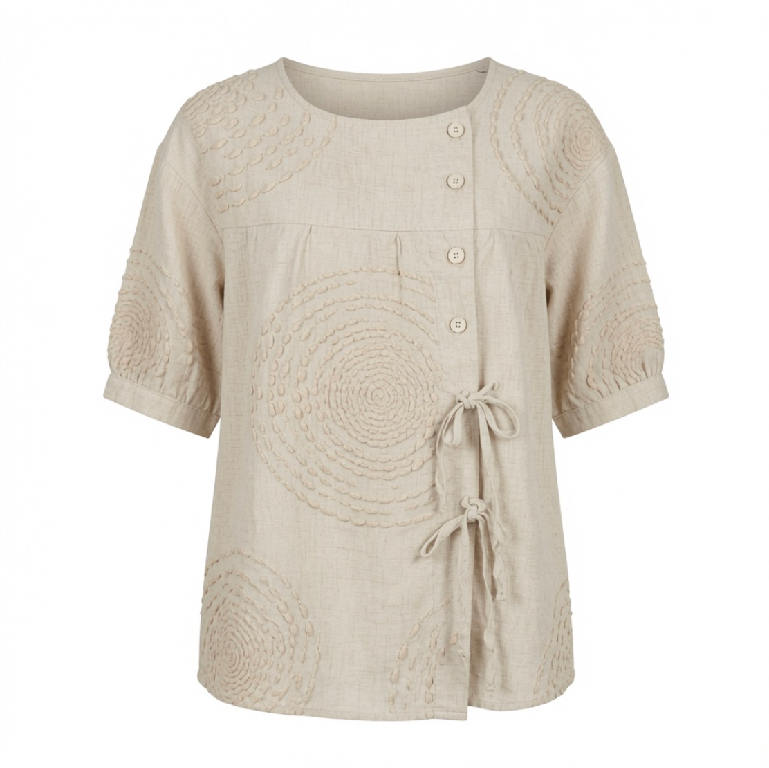 Close-up detail of the raised circular embroidery on the Seraphina casual top, highlighting its texture.